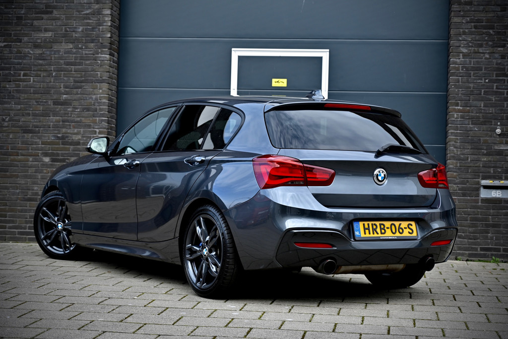 BMW 1 Serie M140i xDrive 480PK | Mineral Grau | Akrapovic | Sublieme staat 52218950-1.jpg | Stan Automotive