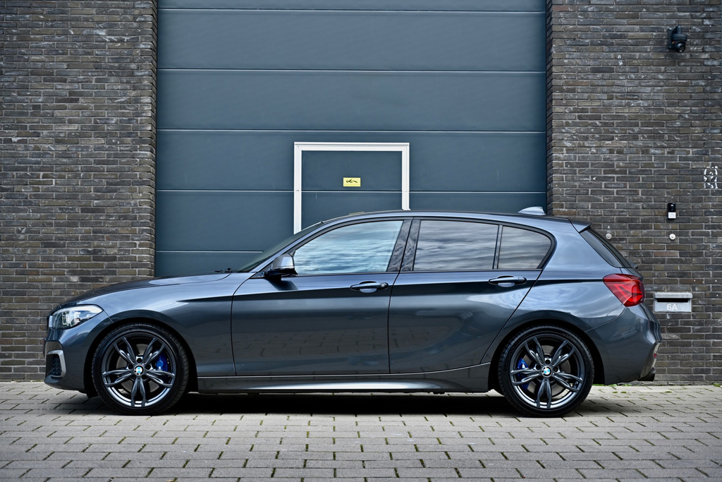 BMW 1 Serie M140i xDrive 480PK | Mineral Grau | Akrapovic | Sublieme staat 52218950-2.jpg | Stan Automotive